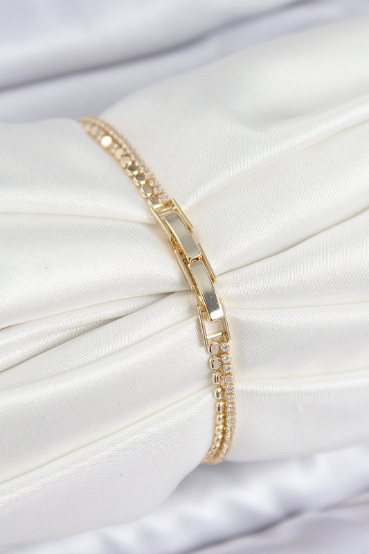 BB7655 - Pirinç Zirkon Taşlı Ezme Zincirli Sıralı Model Gold Renk Kadın Bilekilk