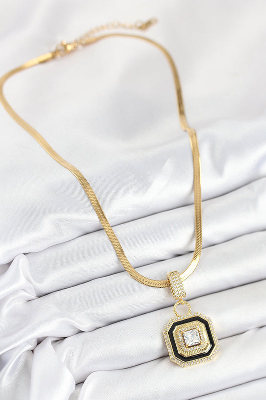 BKO10529 - 316L Çelik Zirkon Taşlı Siyah Detaylı Baget Model Gold Renk Kadın Kolye