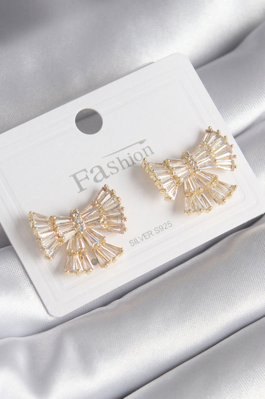 BKP8599 - Pirinç Gold Renk Zirkon Taşlı Kurdele Model Kadın Küpe