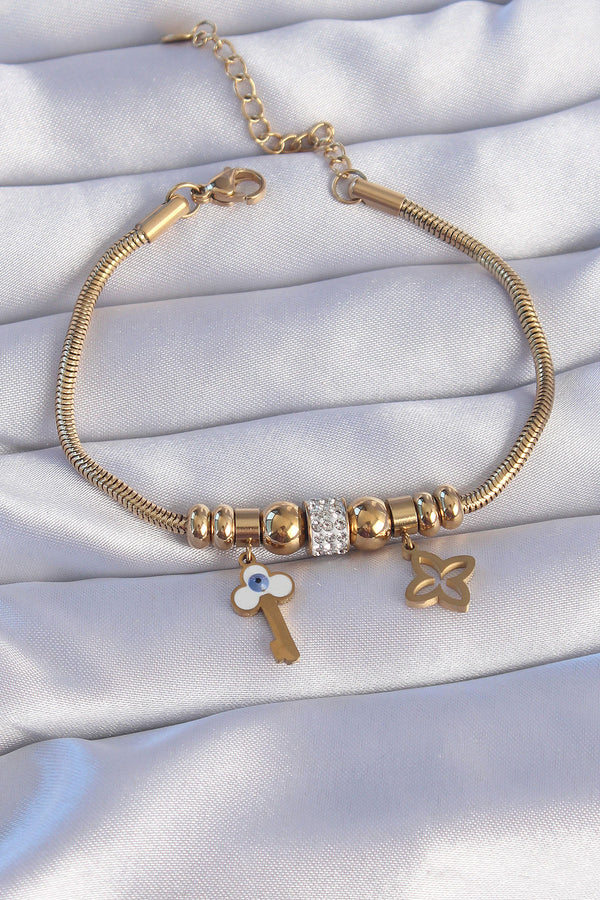 BB6203 - 316L Çelik Gold Renk Zirkon Taşlı Yonca Detay Nazarlı Anahtar Tasarımlı Bileklik