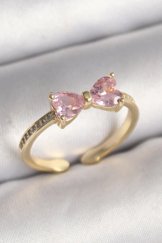 BYK3641 - Pirinç Gold Renk Pembe Zirkon Taşlı Kalp Fiyonk Model Kadın Yüzük