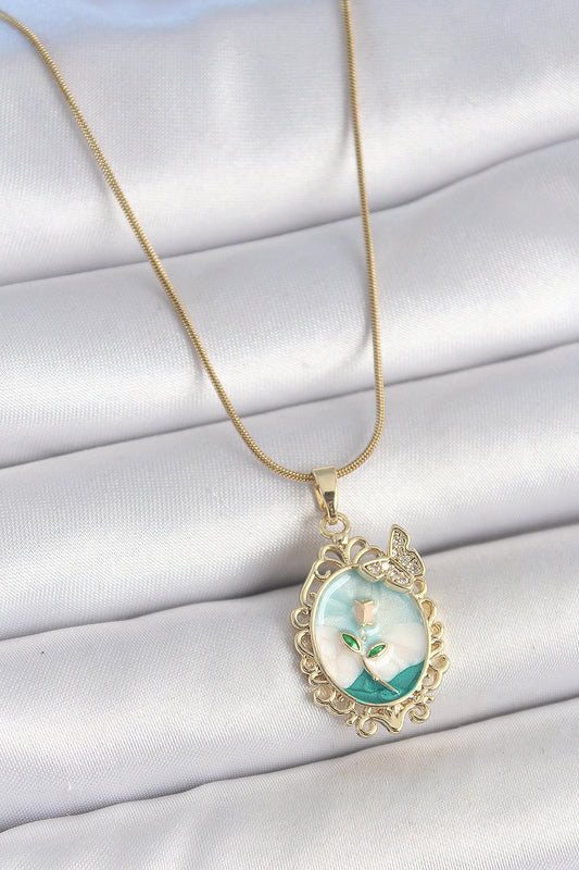 BKO10183 - 316L Çelik Gold Renk Zincir Mavi Mineli Çiçek İşlemeli Zirkon Taş Detaylı Portre Model Kadın Kolye