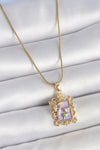 BKO10190 - 316L Çelik Gold Renk Zincir Mor Mineli Çiçek İşlemeli Zirkon Taşlı Kelebek Detay Portre Model Kadın Kolye