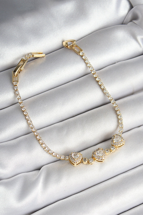 BB6981 - Pirinç Sıralı Kalp Figürlü Zirkon Taşlı Gold Renk Kadın Bileklik