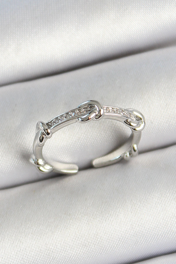 BYK3777 - Pirinç Düğüm Figürlü Zirkon Taşlı Gümüş Renk Ayarlanabilir Kadın Yüzük