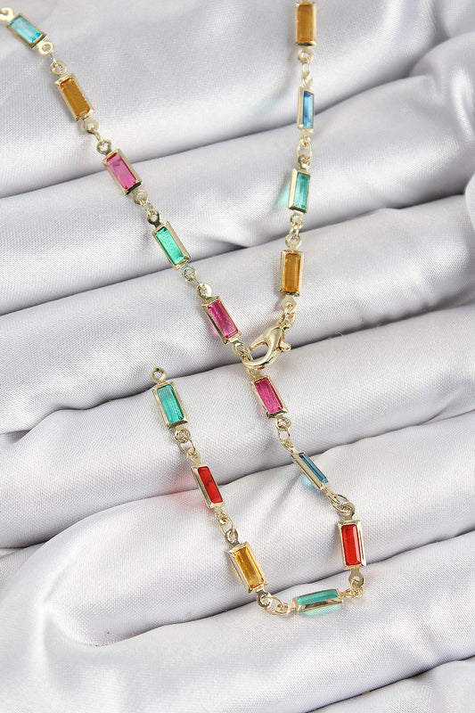 BKO10384 - Pirinç Renkli Zirkon Taşlı Dikdörtgen Model Gold Renk Kadın Y Kolye