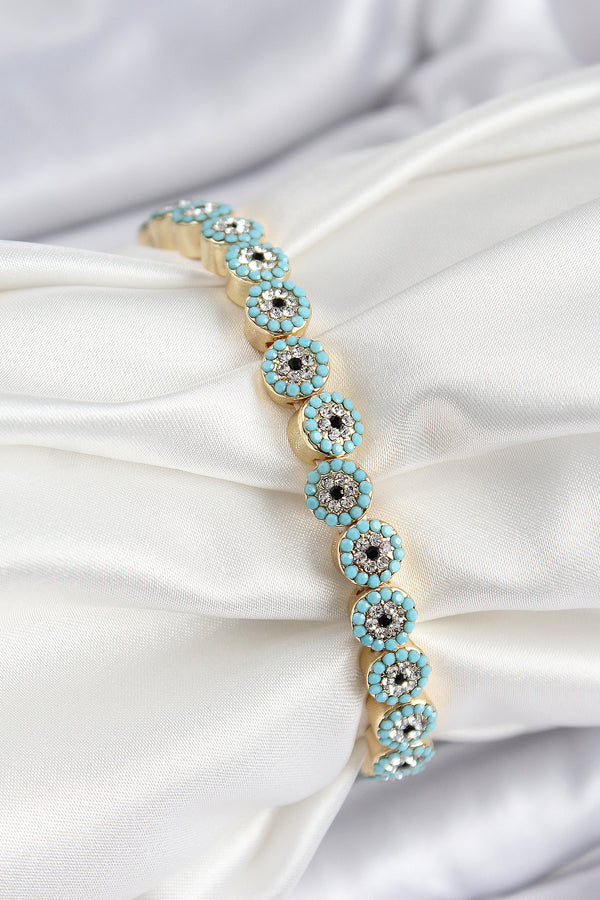 BB7496 - Pirinç Zirkon Taşlı Turkuaz Nazar Model Gold Renk Lastikli Kadın Bileklik