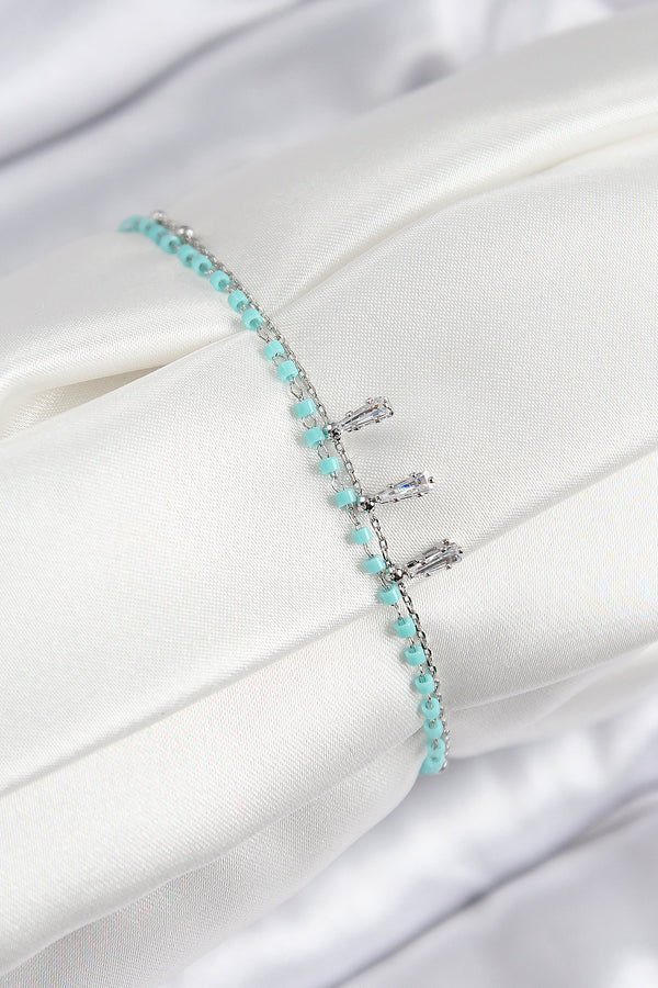 BB7582 - Pirinç Zirkon Taşlı Mavi Boncuklu Model Gümüş Renk Kadın Bileklik