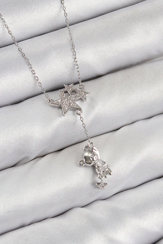 BKO10419 - Pirinç Zirkon Taşlı Sallantılı Ayıcıklı Yıldız Model Gümüş Renk Kadın Kolye