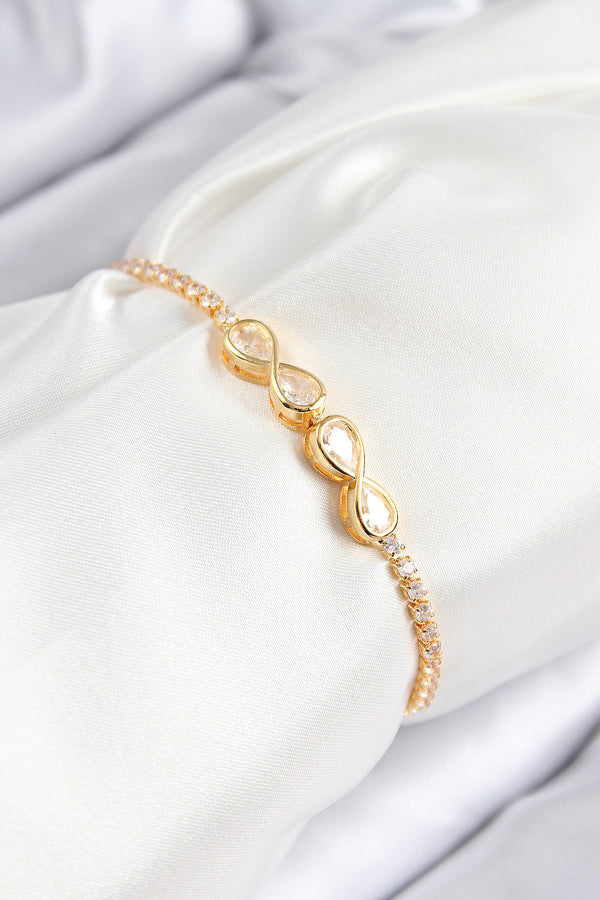 BB7721 - Pirinç Zirkon Taşlı Sonsuzluk Model Gold Renk Asansörlü Kadın Bileklik