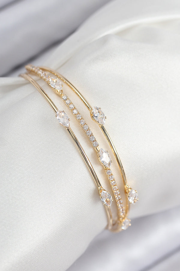 BB7867 - Pirinç Zirkon Taşlı Su Yolu Model Gold Renk Kadın Bileklik