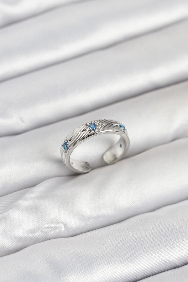 BYK3897 - Pirinç Gümüş Renk Mavi Zirkon Taşlı Kutup Yıldızı Model Kadın Yüzük