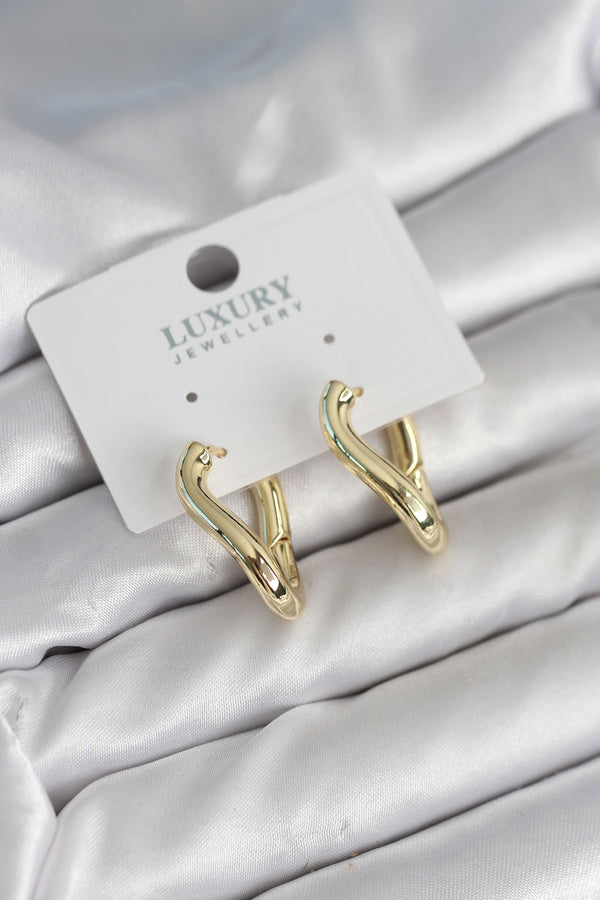 BKP11312 - Gold Renk Eğik Halka Model Pirinç Kadın Küpe