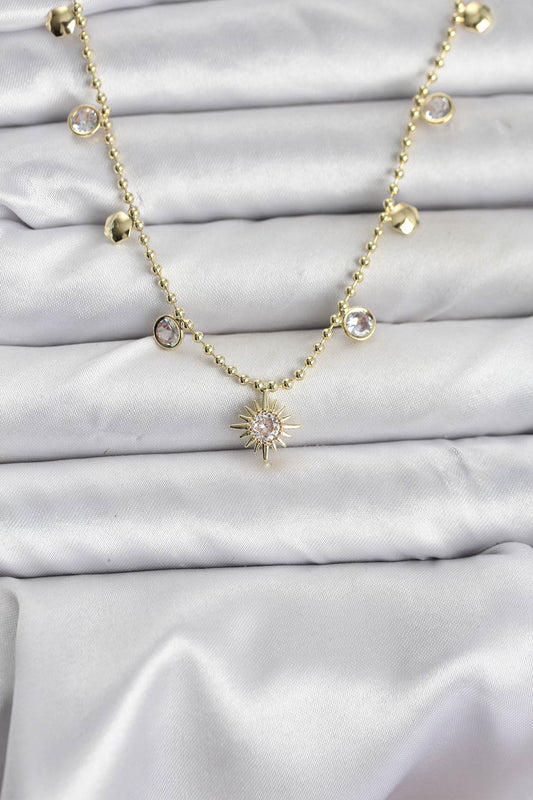 BKO10648 - Zirkon Taşlı Kutup Yıldızı Model Pirinç Gold Renk Kadın Kolye