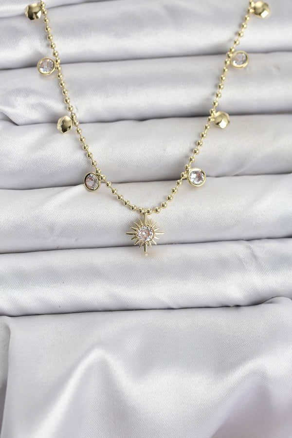 BKO10648 - Zirkon Taşlı Kutup Yıldızı Model Pirinç Gold Renk Kadın Kolye